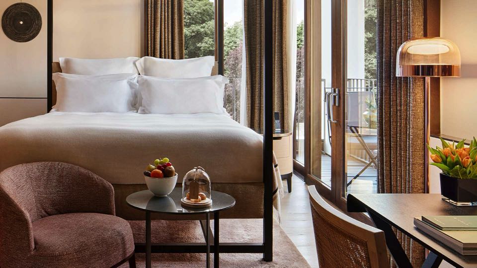 Luxury hotel bedroom with balcony views