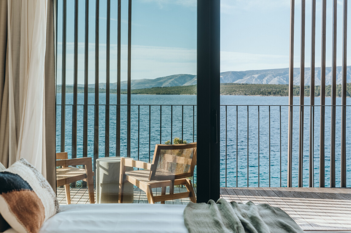 Villa Litica bedroom with panoramic windows overlooking the Adriatic Sea and mountains